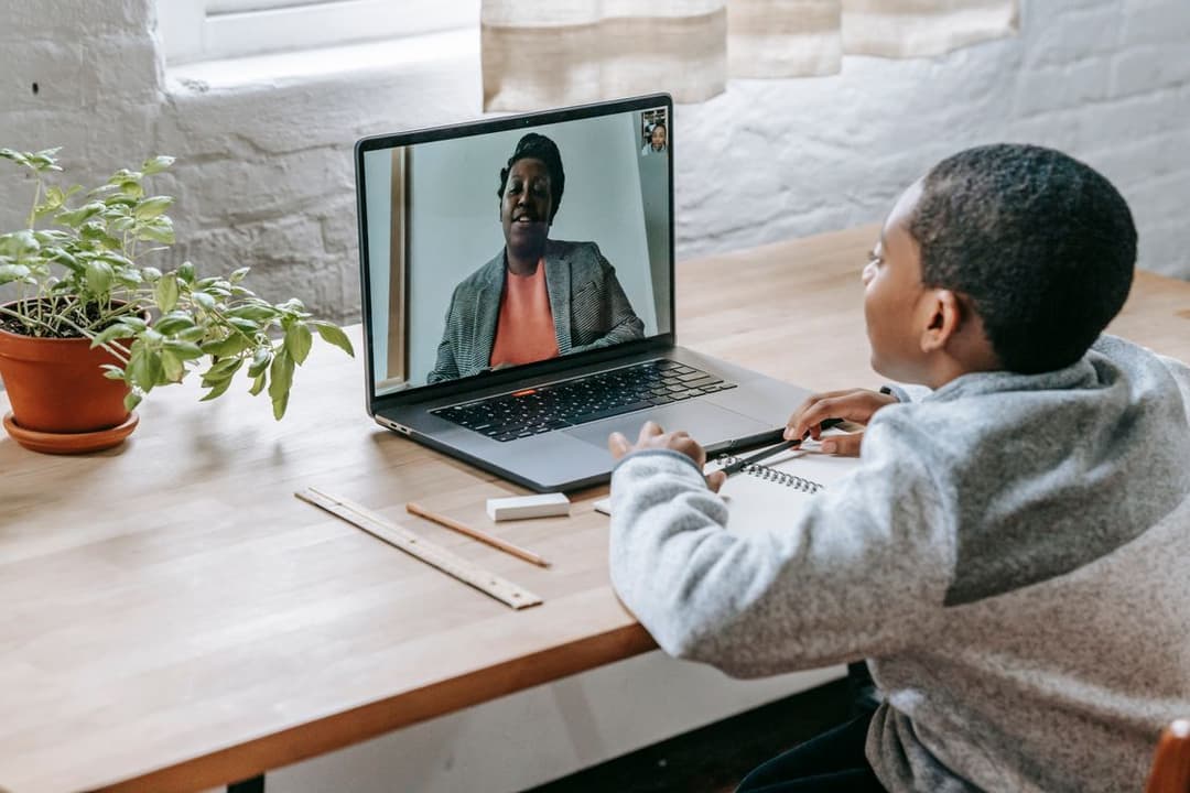 African student attending a live Twi class remotely